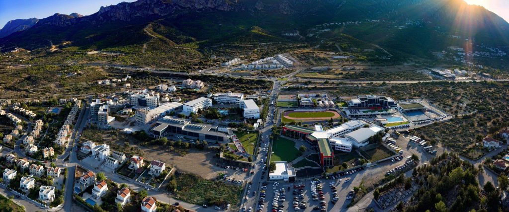 Aerial view of Girne American University (GAU) campus in North Cyprus, featuring modern educational buildings, green spaces, and advanced academic facilities.